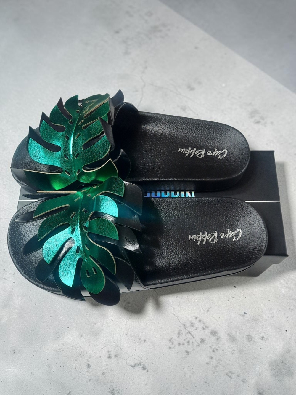 Cape Robbin Black Slides with Metallic Green Leaf Accent